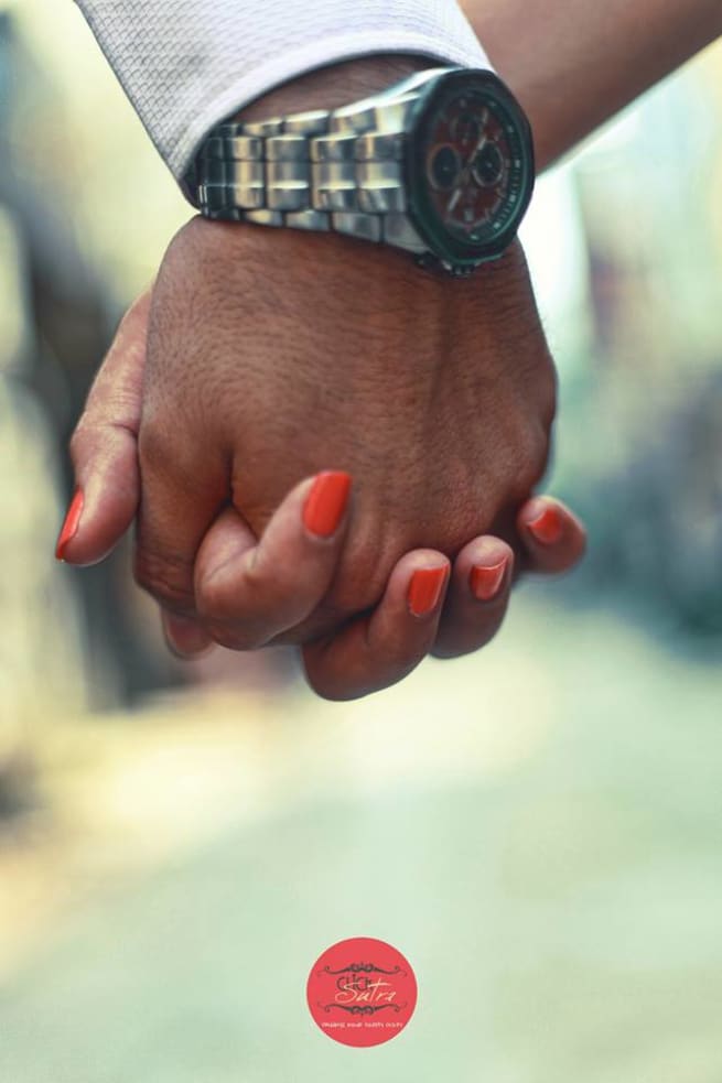 Couple Holding Hands Together