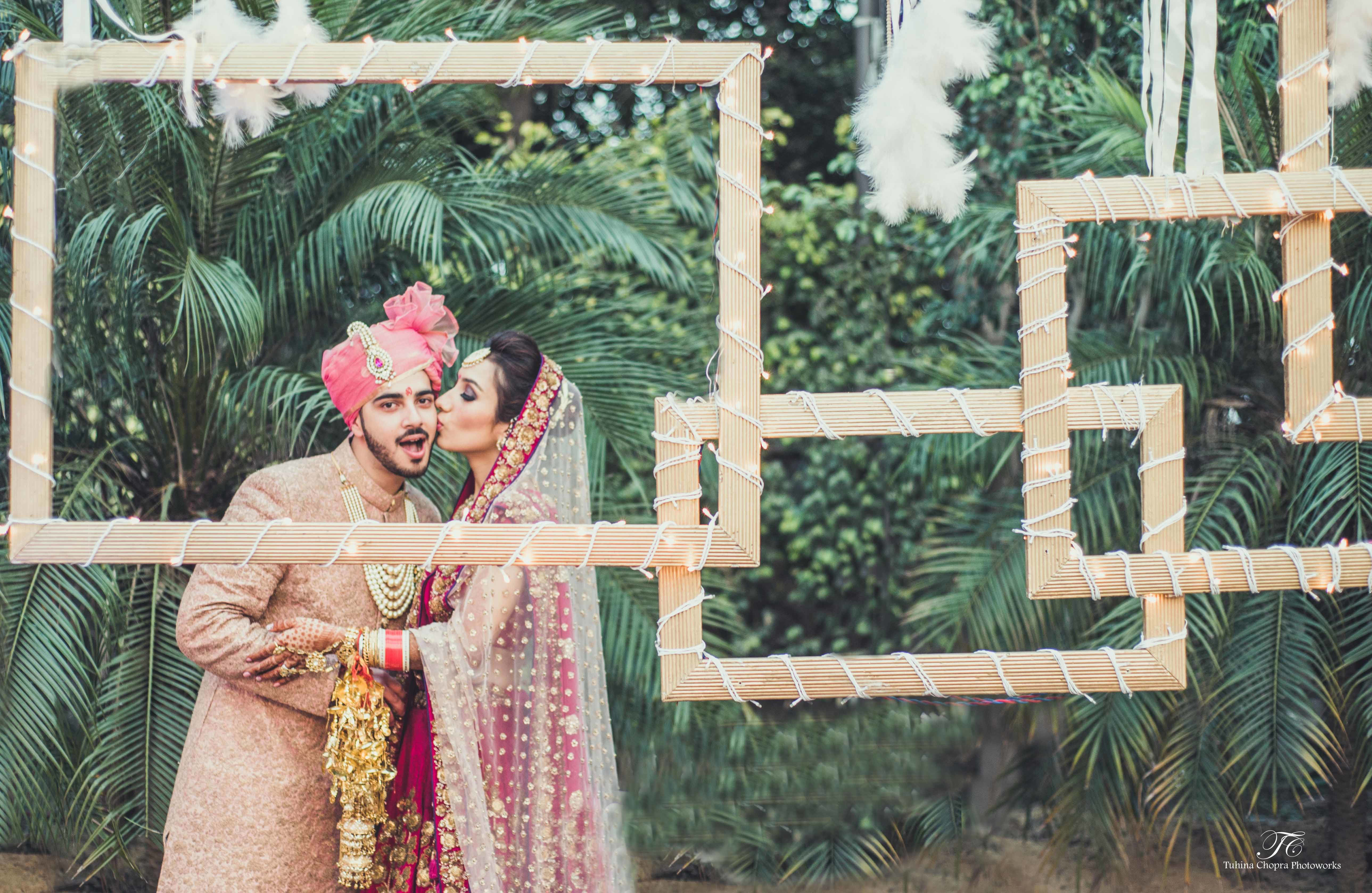 couple shot with frame:tuhina chopra photoworks