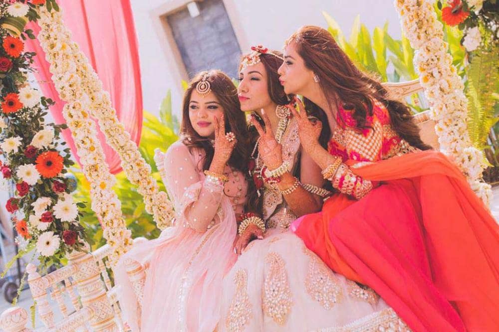 bride posing with friends: